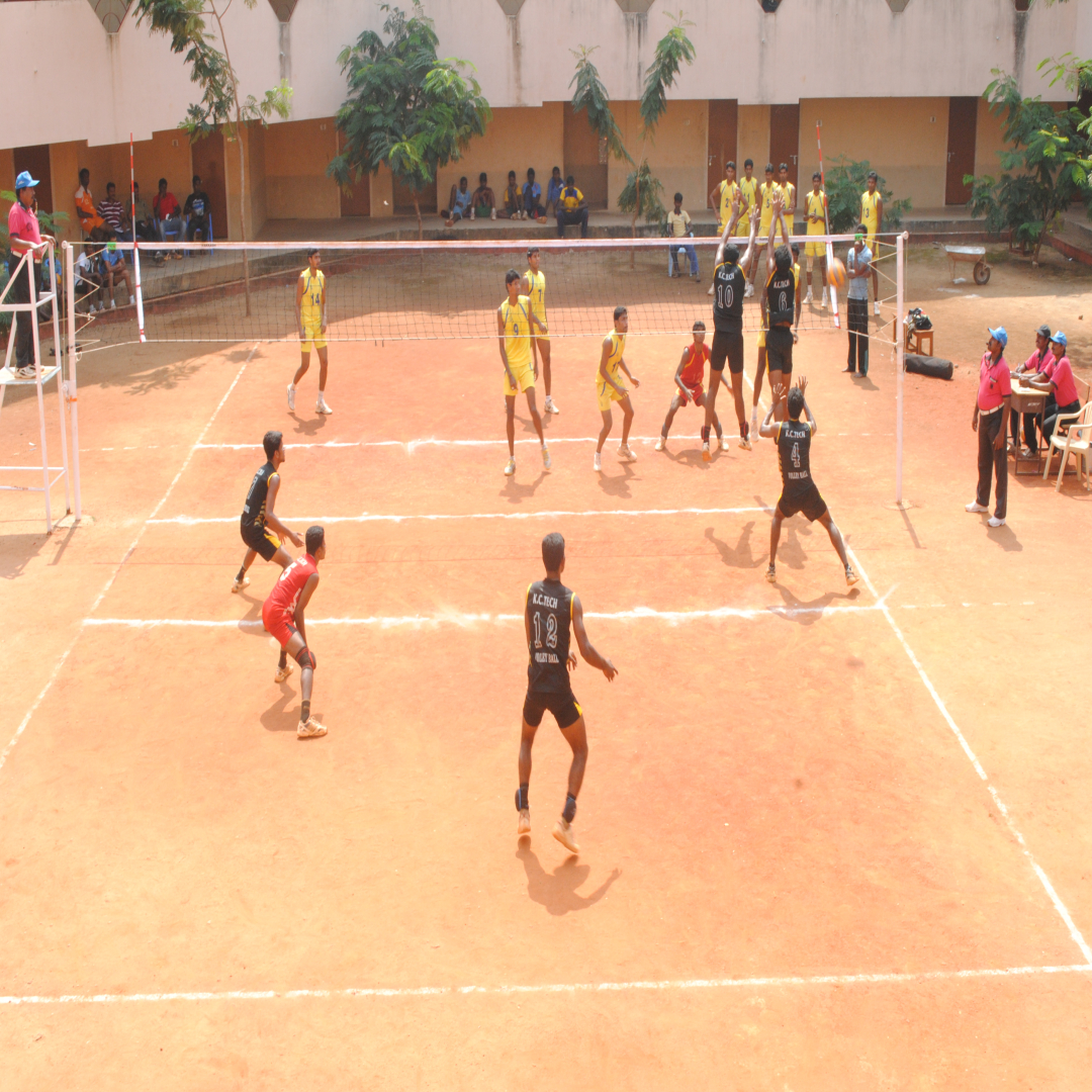 Volleyball team in action during a match with dramatic lighting